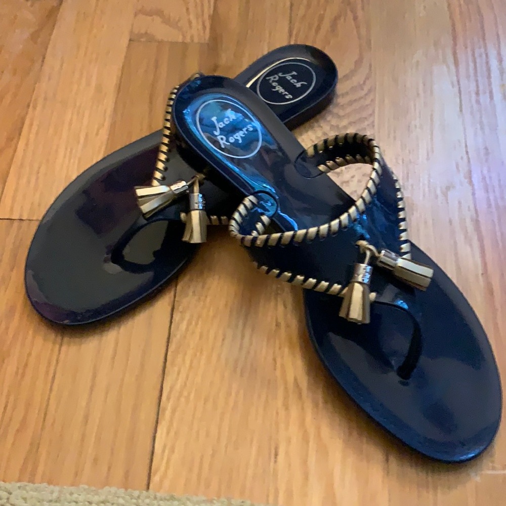 Jack Rogers navy rubber flip flops with gold trim. Excellent condition.